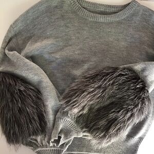 Sweater, light, gray knit. Faux fur elbow embellishment. Woman’s medium.